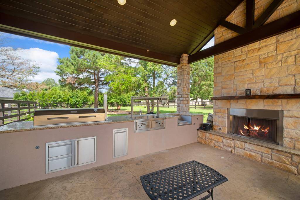 For the ultimate pit master this newly constructed second outdoor kitchen space comes with a custom grill and gaucho station.