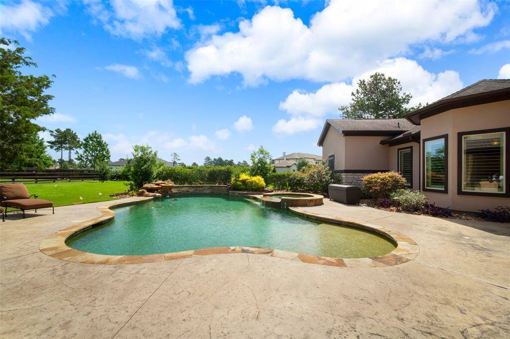 Beautiful pool with expansive decking space.