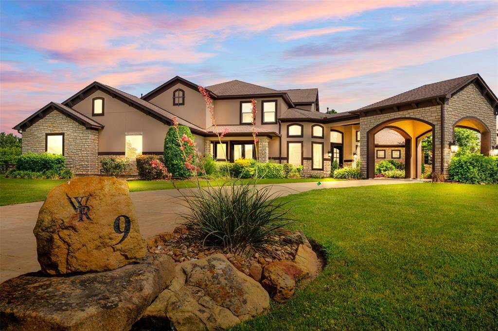 A twilight view of the exterior of the home.