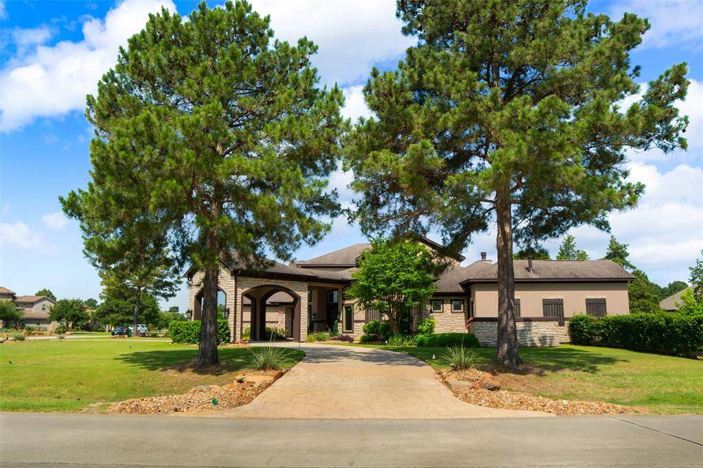 Side view of home entering circular drive.
