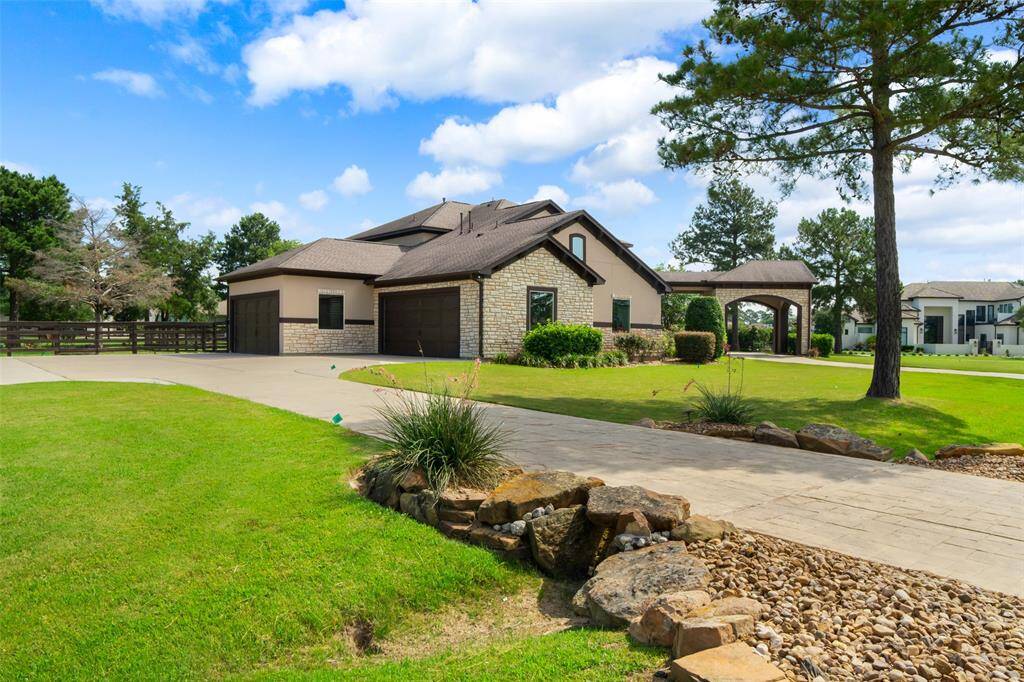 Alternative side view of the home with access to garages.