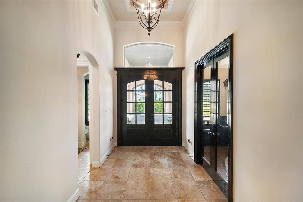 Beautiful foyer. Behind the doors leads to the study.