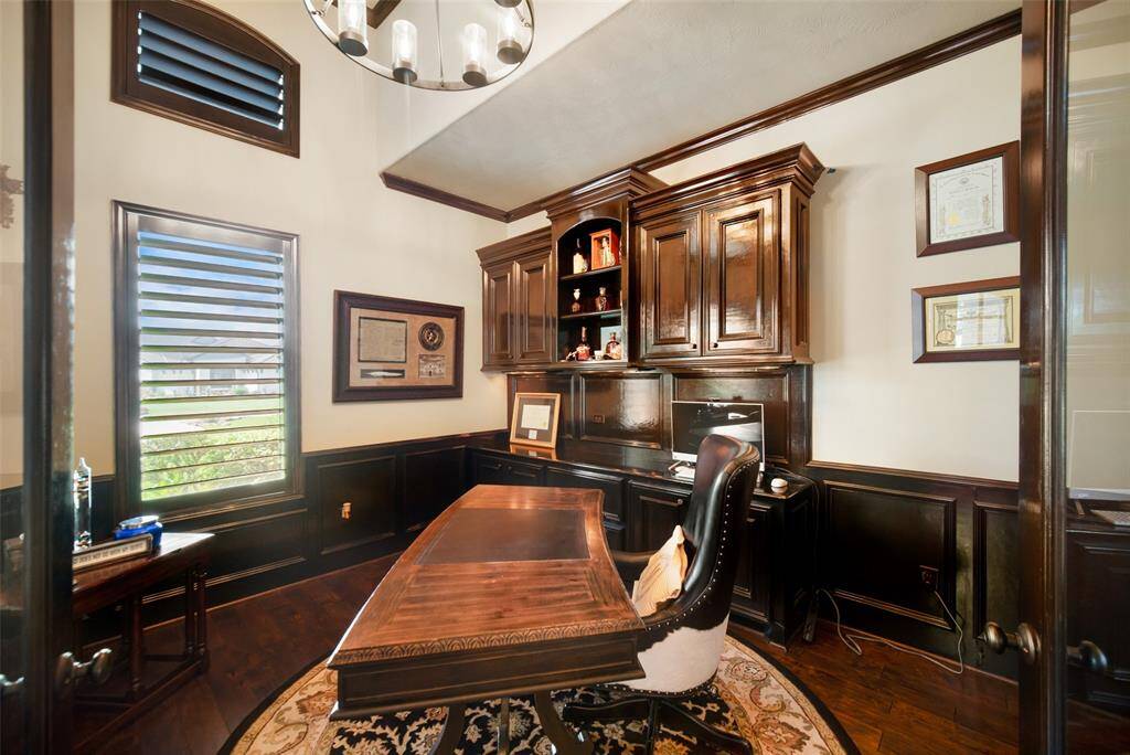 Beautiful study with built in desk & cabinetry.
