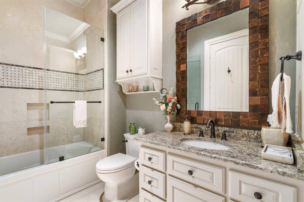 Secondary full baths have all the expected amenities and generous storage.