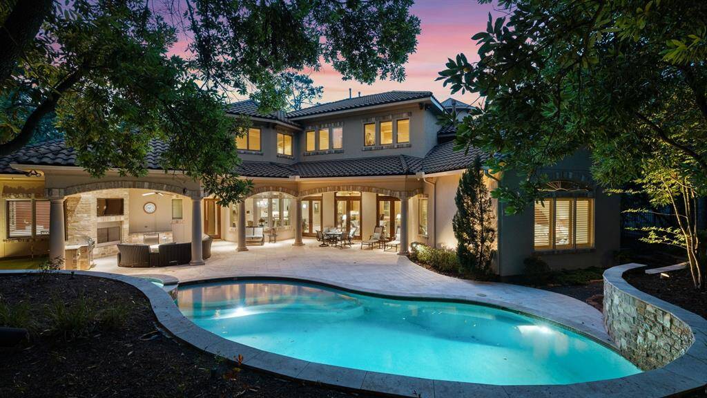Landscape lighting adds a beautiful ambiance to the outdoor setting.