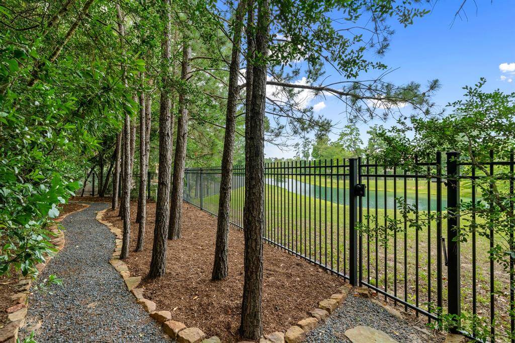 A walking path around the backyard takes in views of both the golf course and pond.
