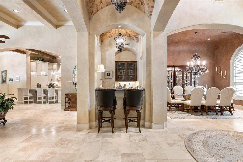 This open concept floor plan provides a spacious layout that allows for easy movement and interaction with family and friends.