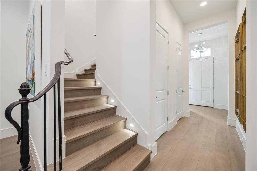Along the entry hallway there is a dedicated coat closet, along with an elevator shaft that is currently a second large storage space.