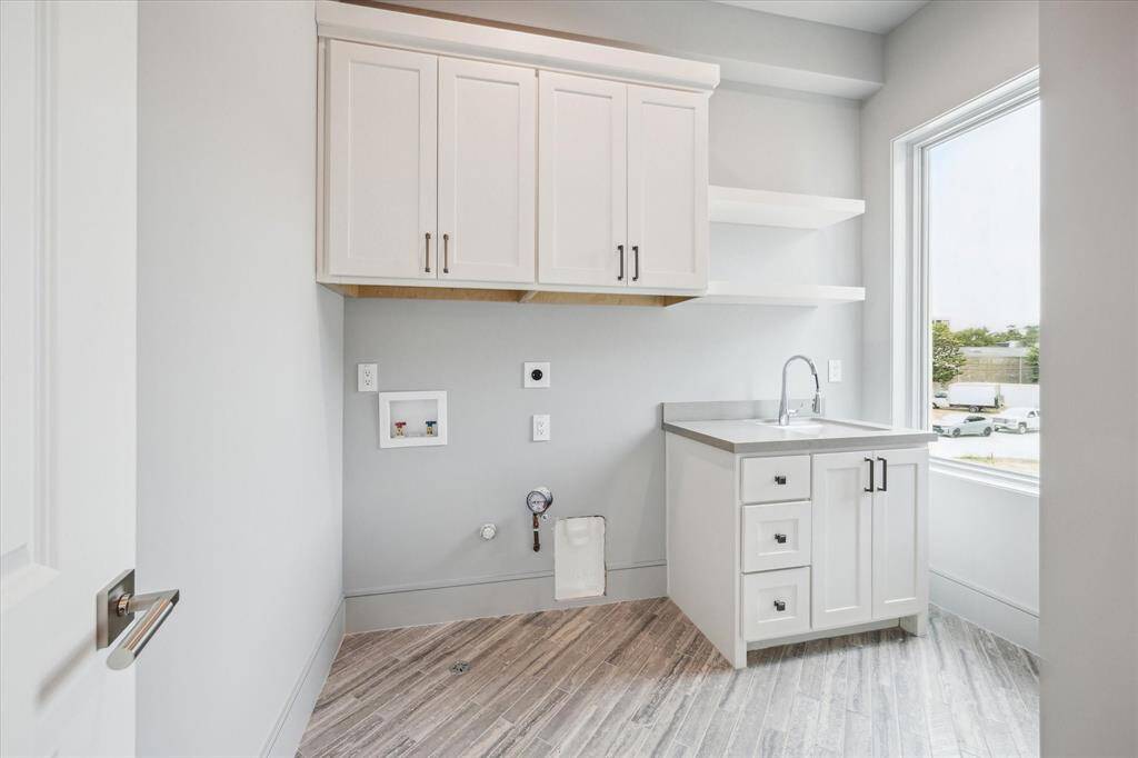 Utility room included on the second floor with plenty of built-in storage, along with Kohler Park Falls enameled cast iron undermount utility sink and Kohler Simplice faucet.