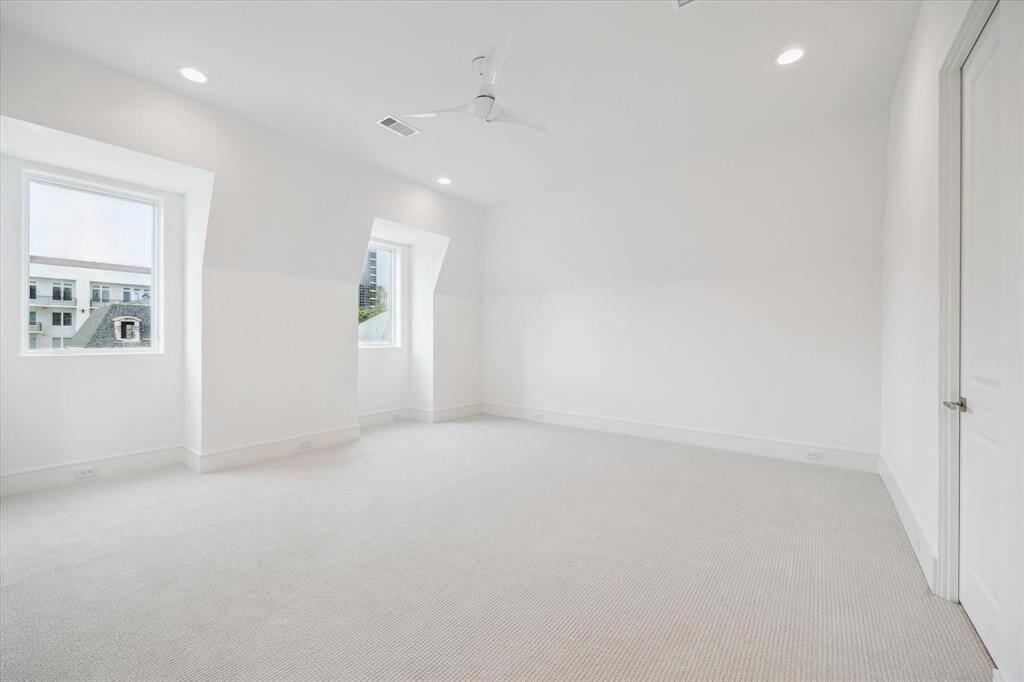 The third floor features this expansive bedroom with oversized walk-in closet and en-suite bathroom.