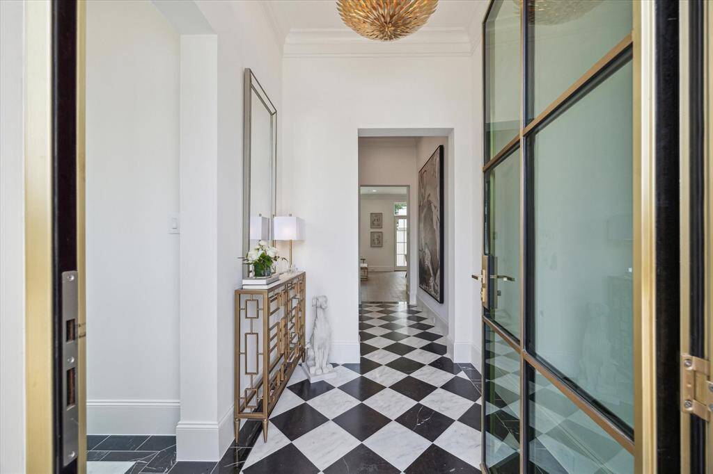 Buyers can choose to upgrade from solid African Mahagony front door to a steel and glass door with dozens of different finishes for the metal. *Photo is of another home in the community and for informational purposes only.
