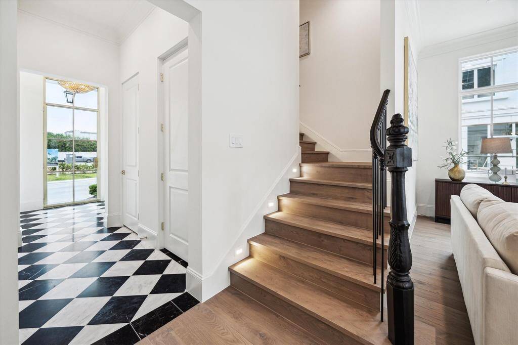 Additionally, black and white polished tile floor upgrade is available to create a bespoke entry. *Photo is of another home in the community and for informational purposes only.