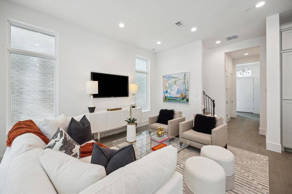 The stunning first floor was designed with relaxation and entertaining in mind! Spacious enough for ample seating, a large dining table, and an island with additional seating that overlooks the living space.