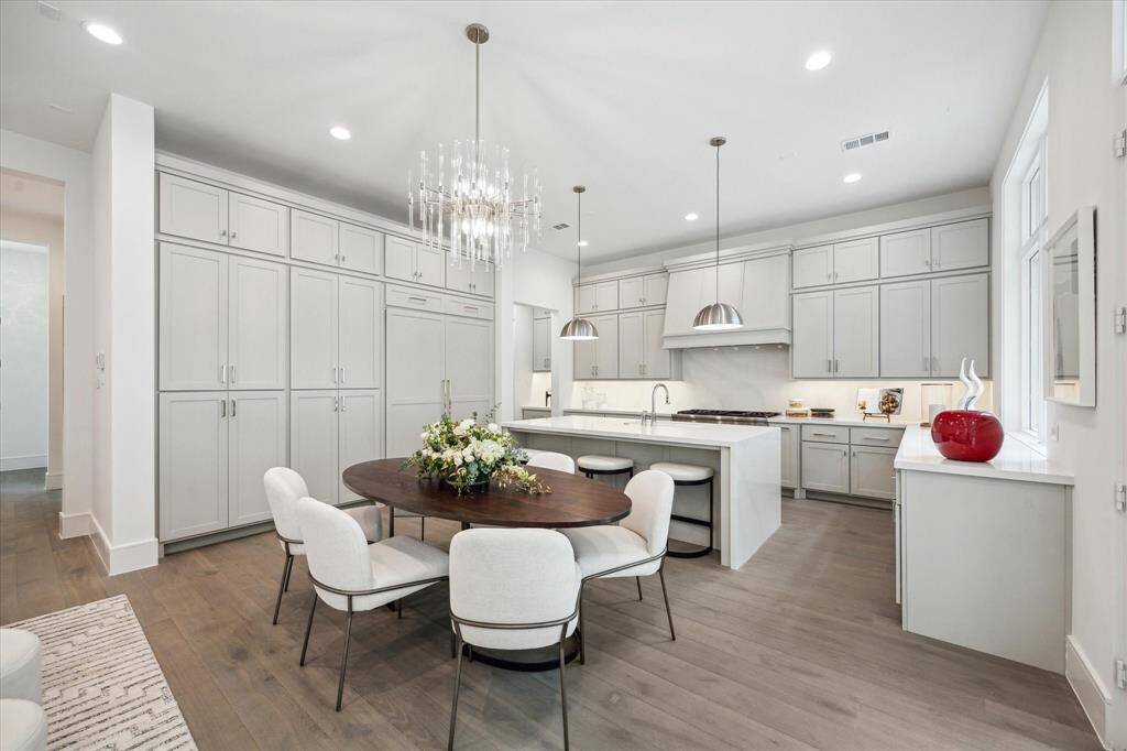 Dining space is located directly off of the living. Ample windows and a set of french doors fill this space with light.