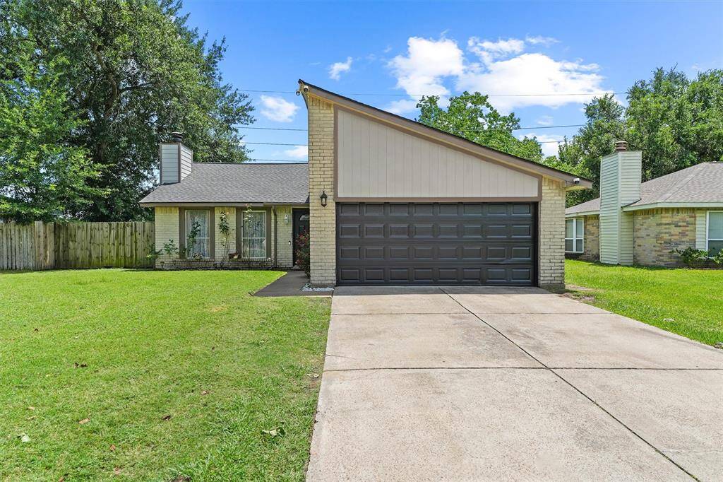 This cheerful home welcomes you with a classic brick exterior and just the right touch of modern flair. The bold garage door and trim add a stylish contrast, while the rose-lined entry and wide green lawn whisper, “you’re home.” Bursting with warmth, simplicity, and curbside charm—it’s the kind of place that just feels right.