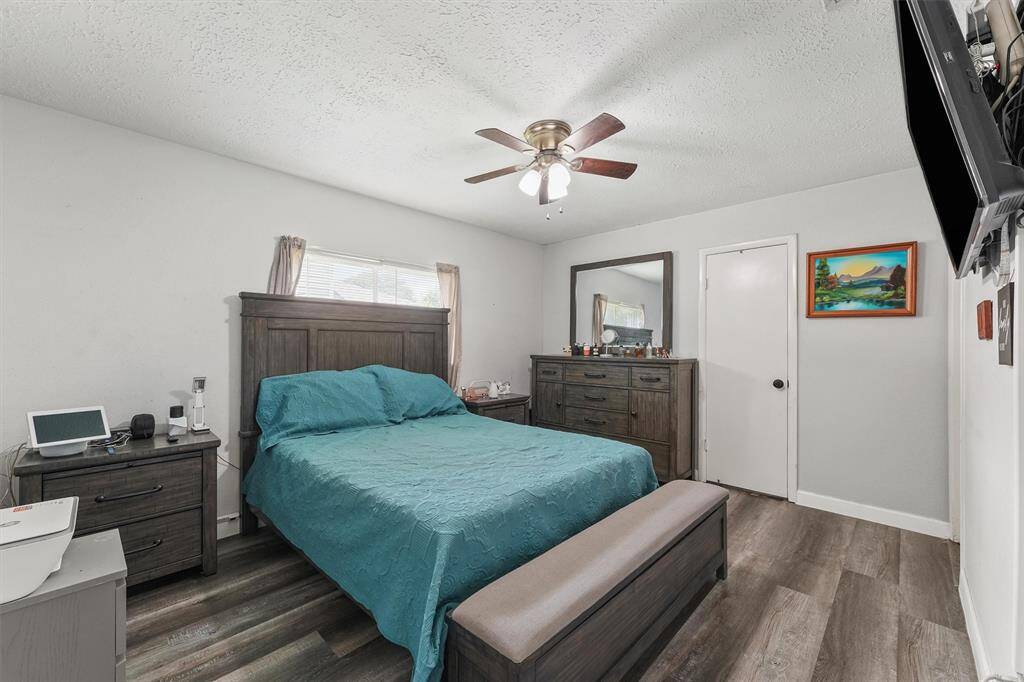 This serene owner’s retreat features calming tones, rich wood flooring, and ample space to relax and recharge. A true escape at the end of the day.