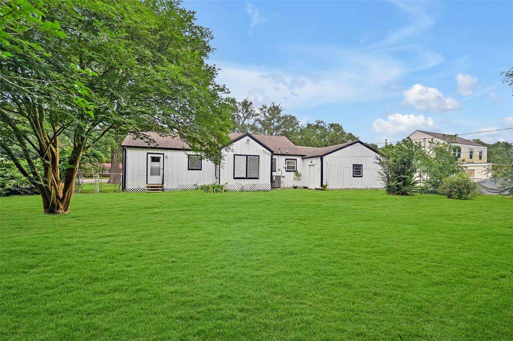 view of back of house with huge backyard