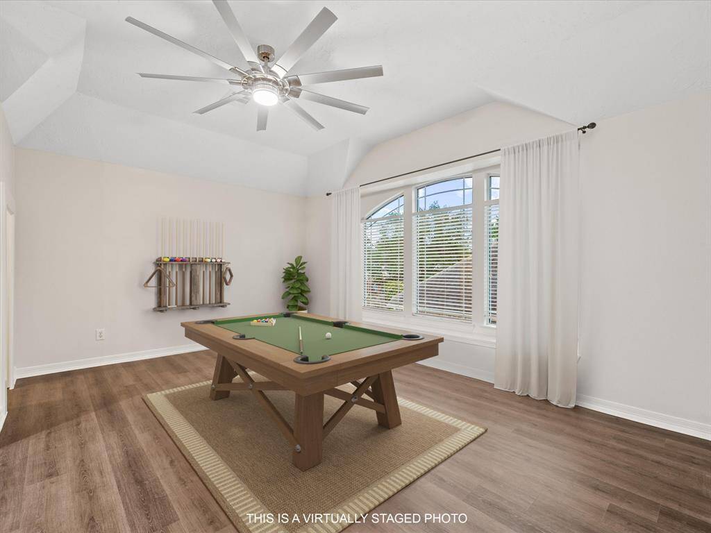 GAMEROOM SPACE UPSTAIRS with large windows! *This is a virtually staged photo