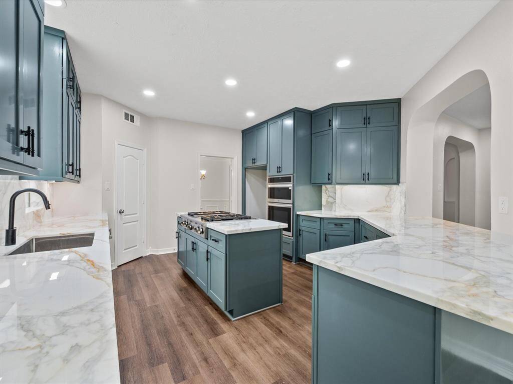 An island with a NEW GAS cooktop & look at all that cabinet storage!