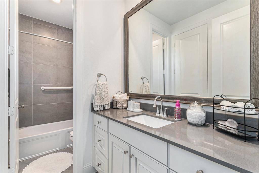Luxurious en suite bathroom with elegant finishes and modern amenities.