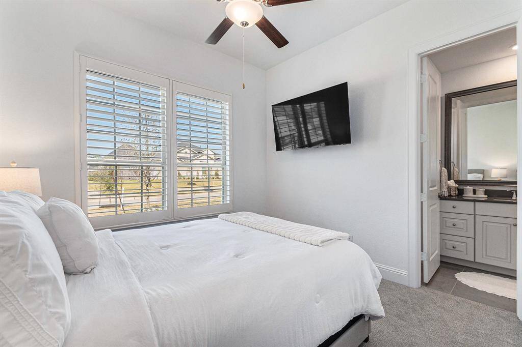 A private bedroom featuring an en suite bathroom for ultimate comfort.