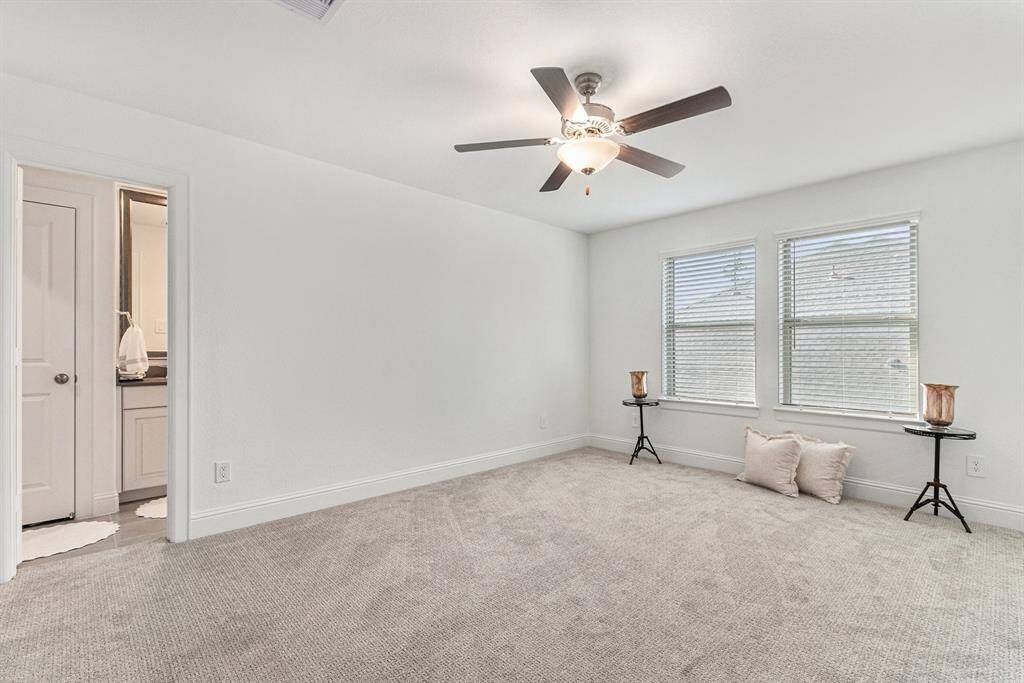 Spacious upstairs bedroom with private en suite bath.