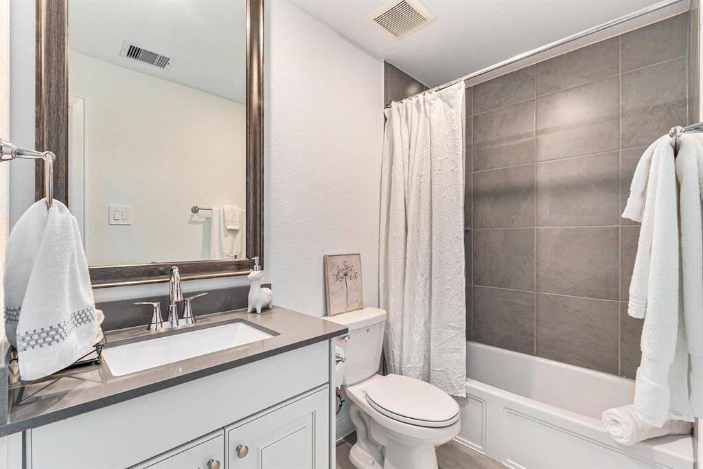 Stylish and modern upstairs bathroom with elegant fixtures and a sleek design.