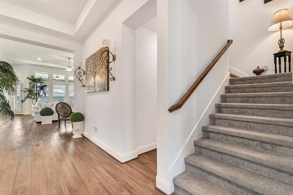 Welcome home to an inviting entrance with elegant hardwood floors, abundant natural light, and a seamless flow into the living area.