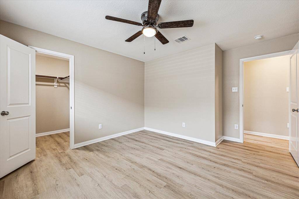 Primary bed room is located at the back of the home with full bath, walk-in closet and a view of the back yard.