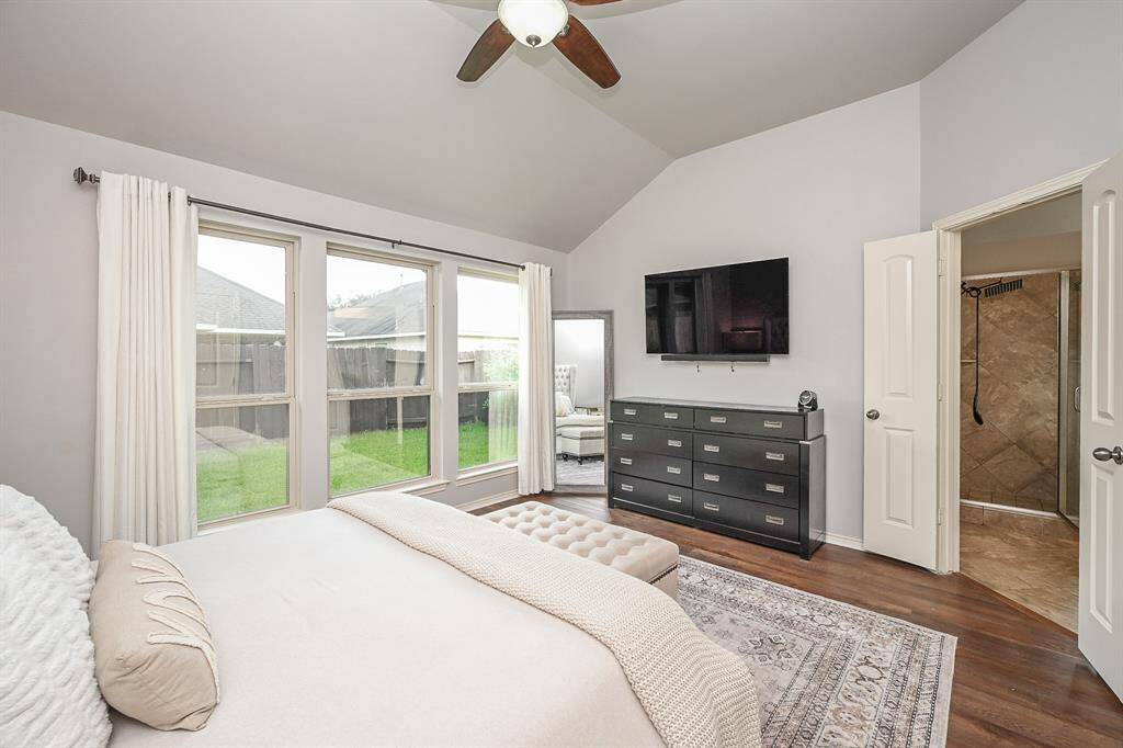 Double doors lead to the primary suite bath
