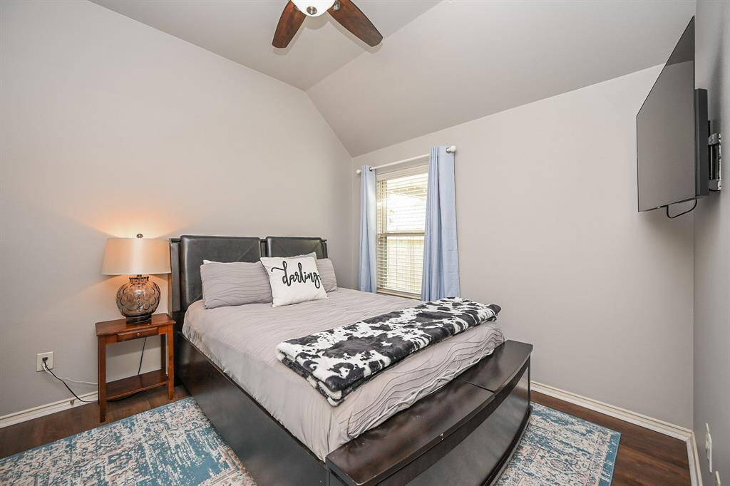 All secondary bedrooms are spacious and offer wonderful closet space. The tall coffered ceiling follow throughout the house. Soft neutral tones and a window makes this room nice and bright.