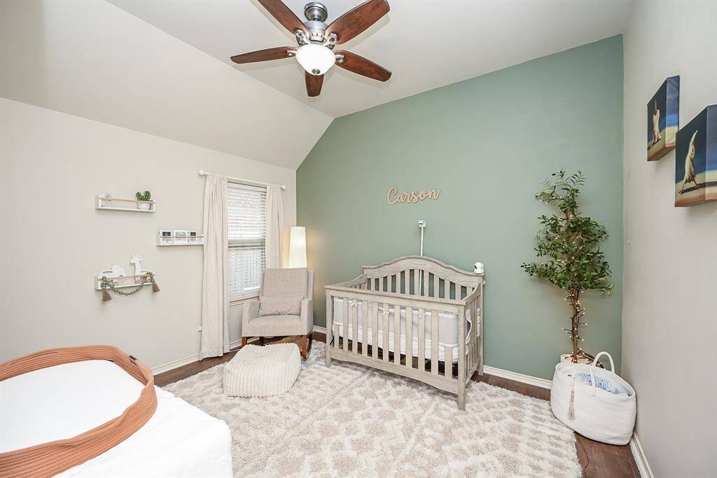 Third bedroom similar to the other secondary bedroom Neutral color highlighted by a soft and relaxing accent wall. Window, beautiful flooring, a ceiling fan and a great closet finish off this beautiful room.