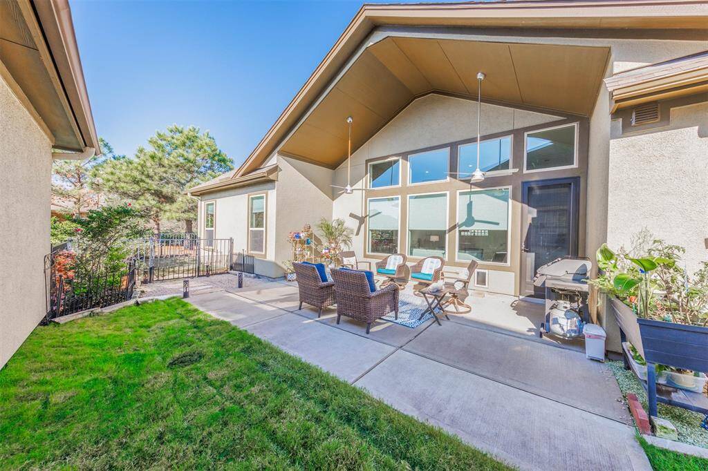 The side yard of this fantastic home includes a covered patio with ceiling fans, extended patio and landscaping. This area is the perfect place for outdoor cookouts with family and friends or a great place to relax at the end of the day!