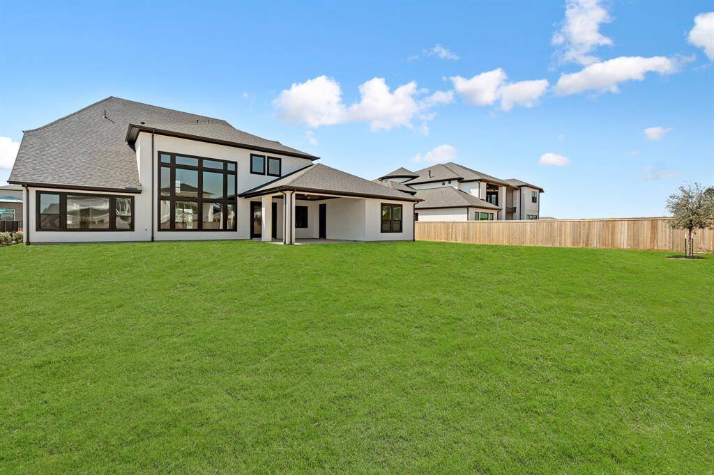 Spacious backyard with room for a pool and lots of space for outdoor entertaining and gatherings with the sizeable covered patio area.