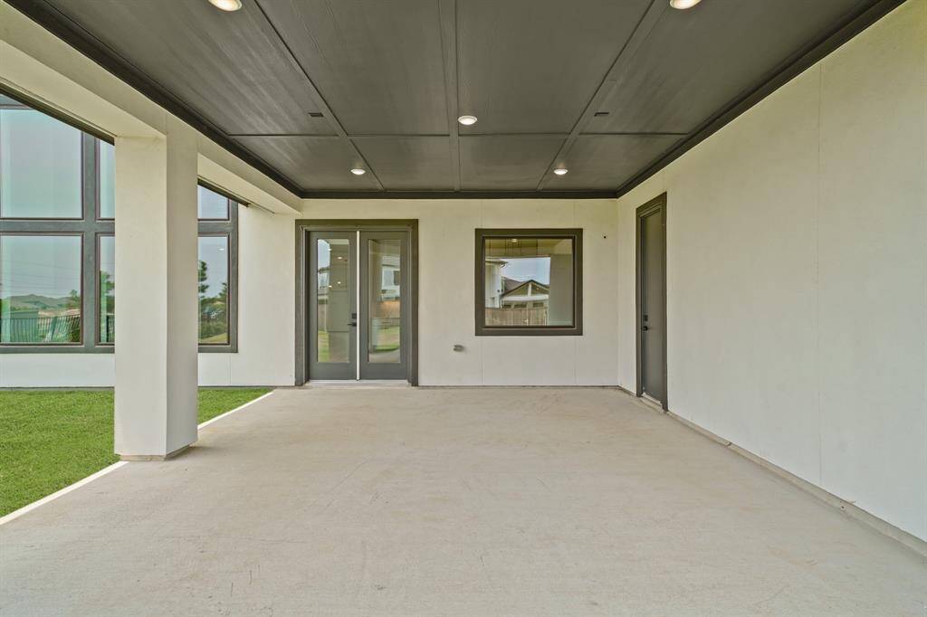Expansive empty backyard patio with a full bathroom ready to be transformed into the ultimate outdoor retreat.