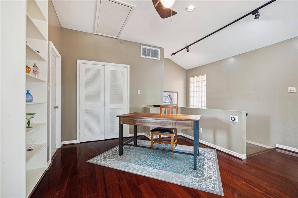 Front House: Bright, open office space features a built-in bookshelf.