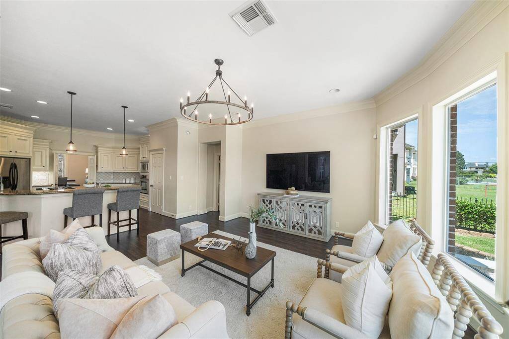 A view capturing the open-concept design where the inviting living room flows seamlessly into the kitchen area.