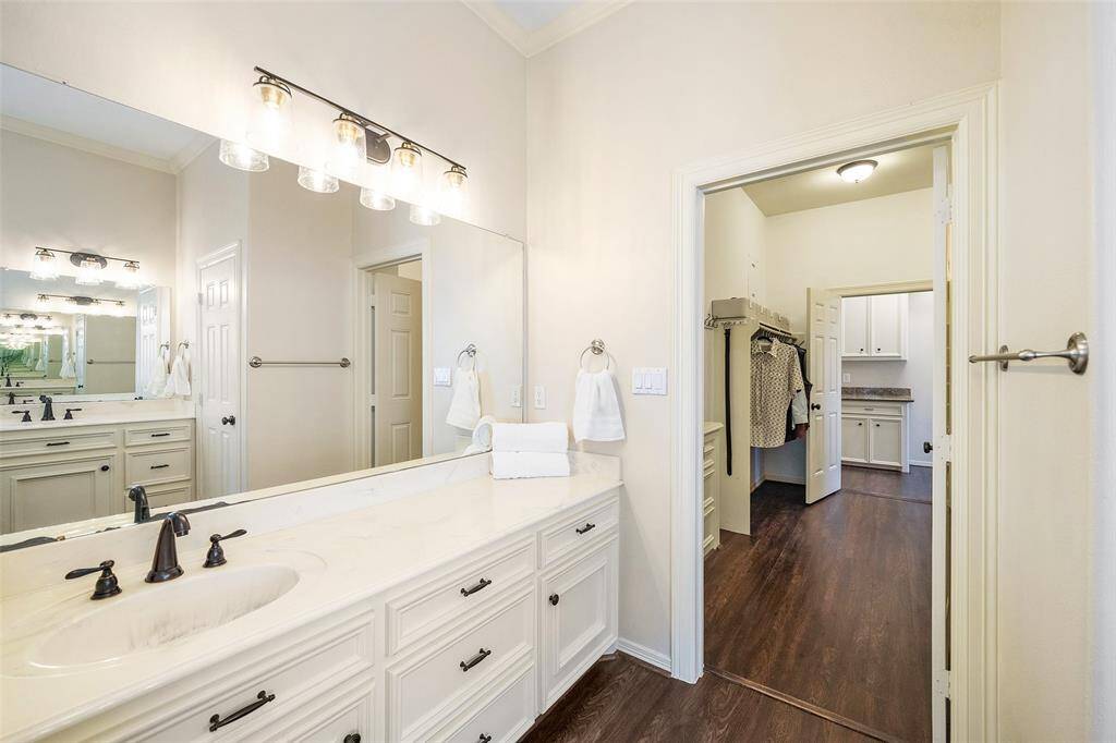 Primary bath looking into large closet.