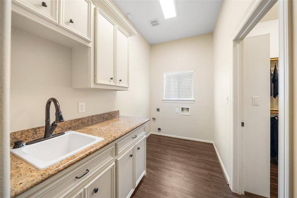Laundry Room attached to primary closet.