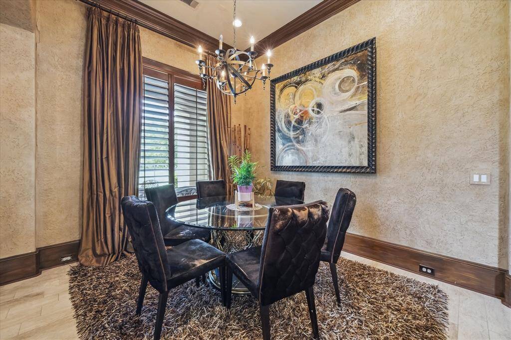Breakfast room located off the kitchen and family room overlooking the backyard and hole #15 of Royal Oaks Country Club.