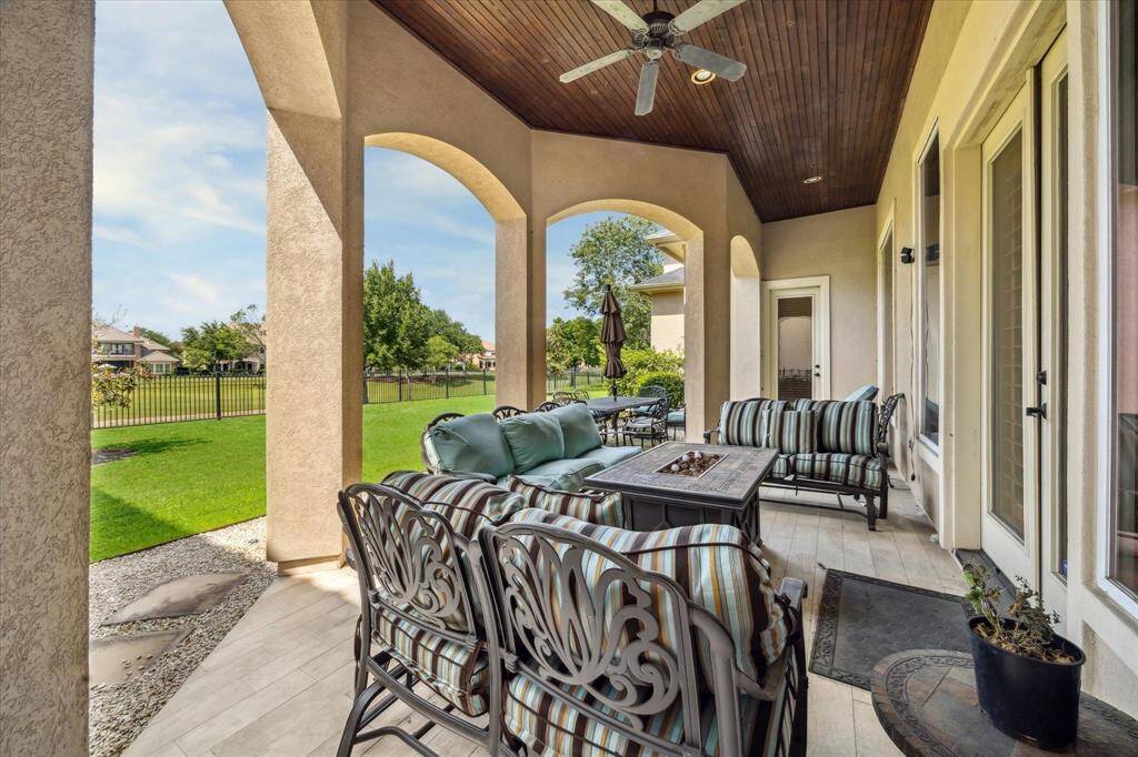Outdoor lanai with beaded board stained ceilings, ample green space, plenty of room for a pool all overlooking Hole #15 and The Estates of Royal Oaks Country Club.