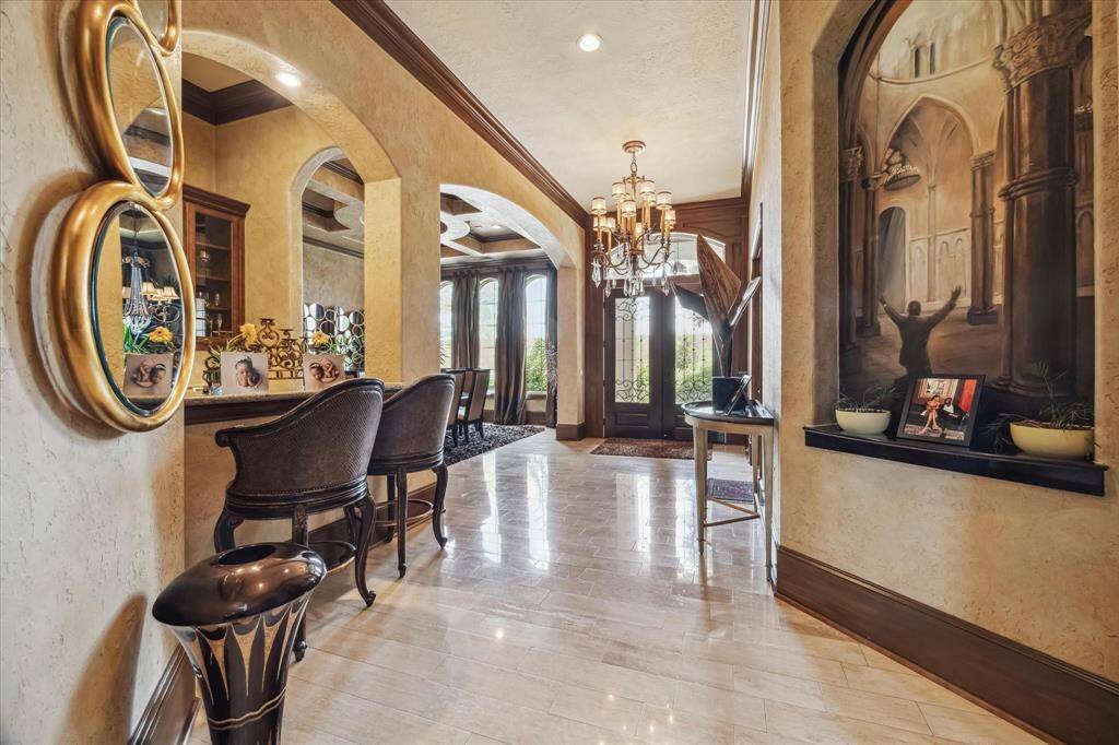 View from the gallery to the entry and opening to the serving bar between the kitchen and dining rooms.