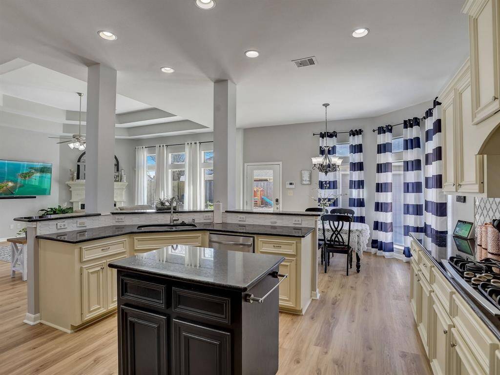 Check out the island, featuring a hand towel rack! This Kitchen is amazing!