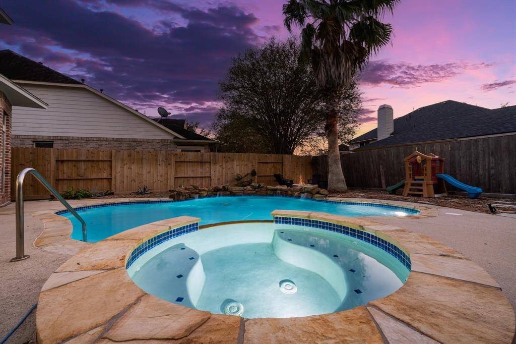 The fire pit, in the background, is a cool place to hang out with your loved ones and friends.