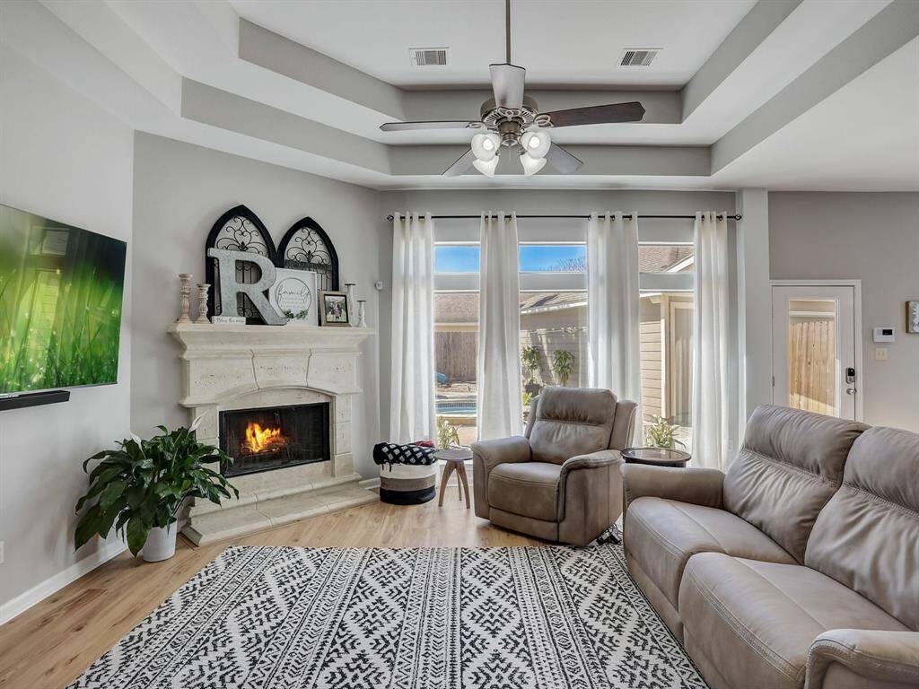The cast-stone fireplace is great for warming a chilly night, or, set the mood for a date night in!