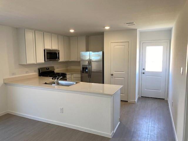 Kitchen exits to backyard