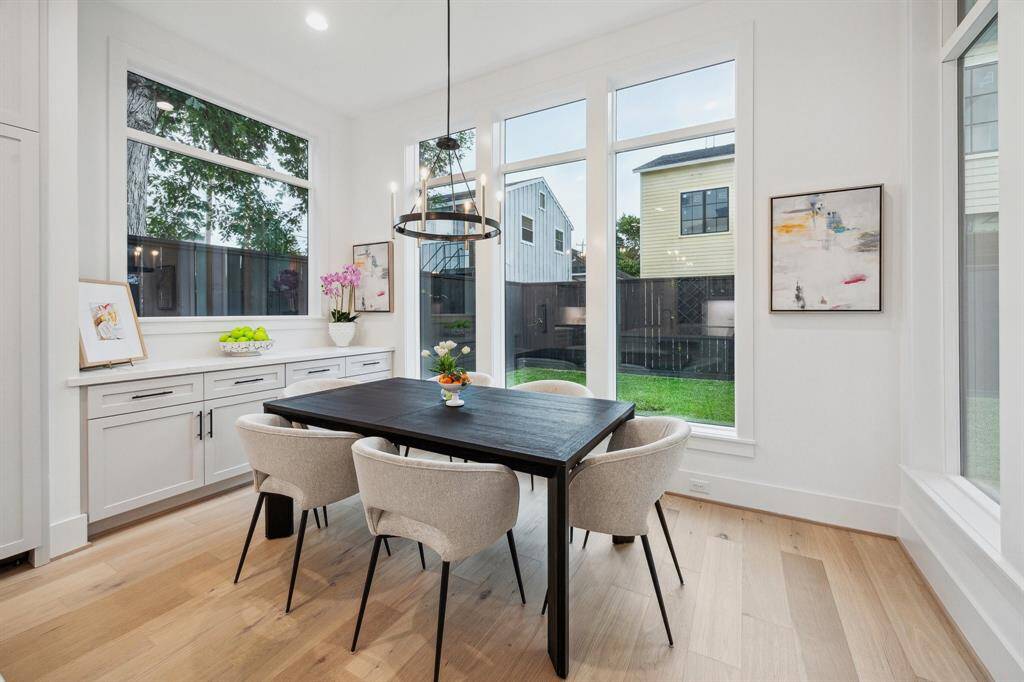 Breakfast area with built-in Buffet and storage drawers/cabinets.   There is also a 6 Light 24-3/4" Wide Ring Chandelier, finished in Mystic Black.