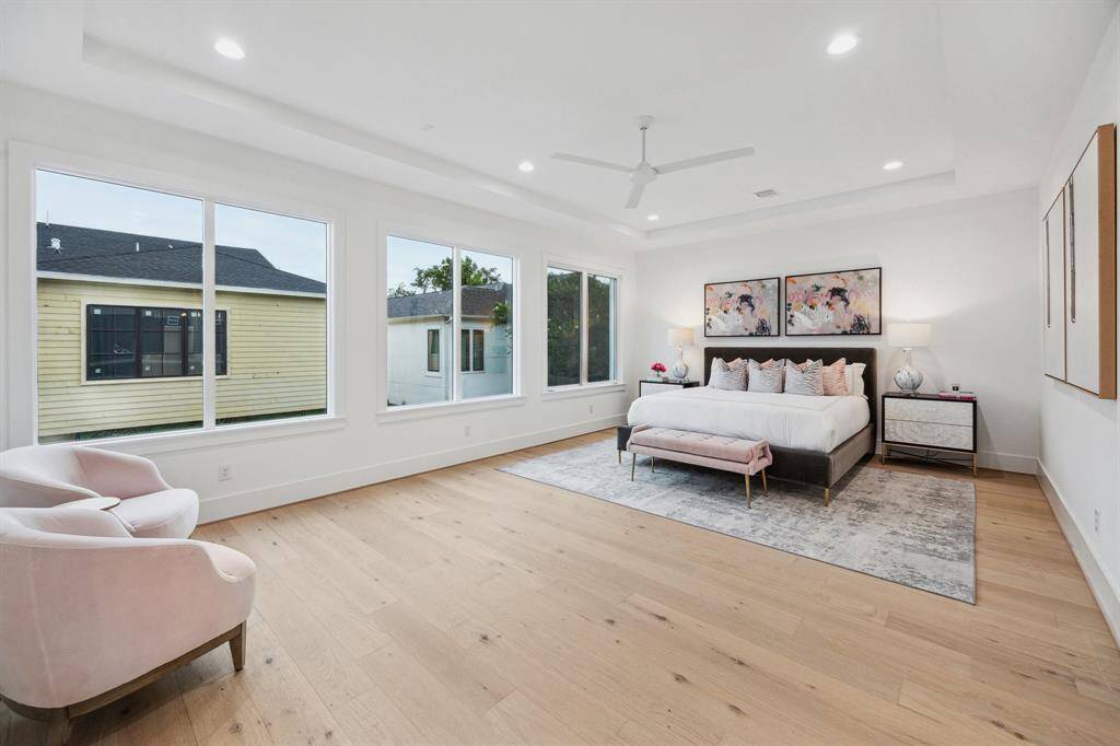 Stunning Primary Bedroom with a Coffered Ceiling, MinkaAire 62" 3 Blade Ceiling Fan, Gorgeous Floors and more....