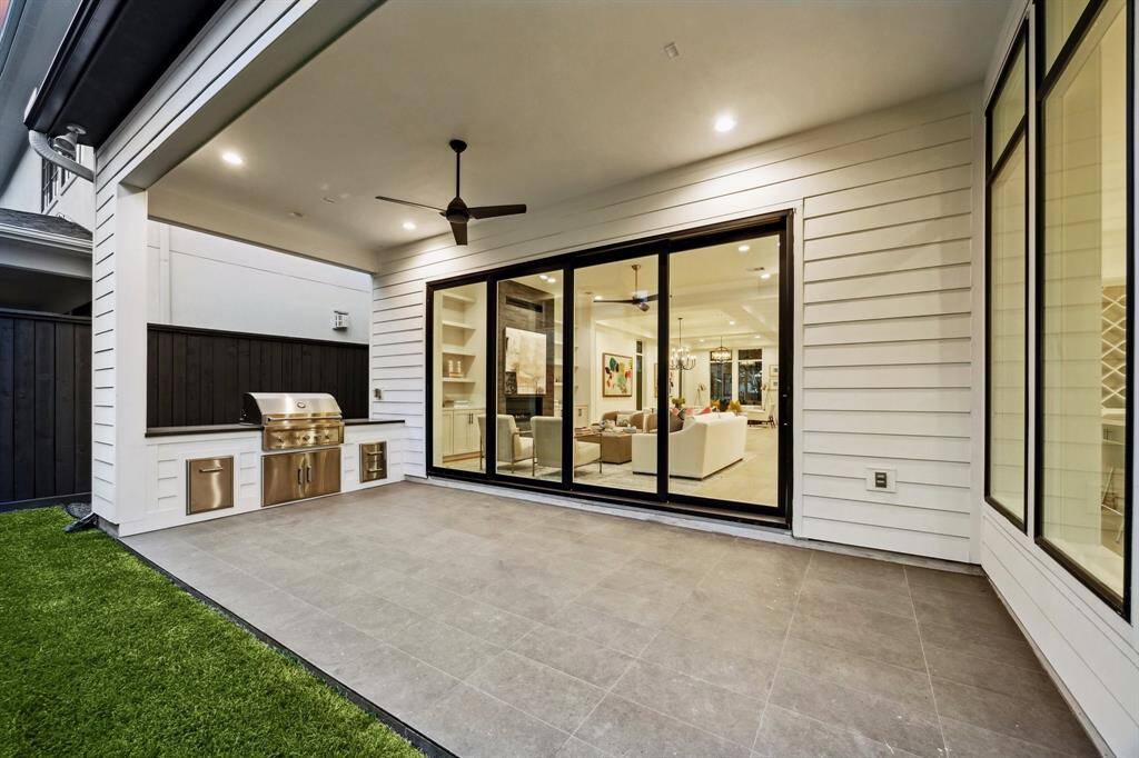 There is a Covered Lanai with an Outdoor Kitchen, which Slab Granite Top, a 36" Stainless Grill, Stainless Storage Drawers and Stainless Trash Drawer. The Floor Tile is 12 X 24 Anti Slip Tile.