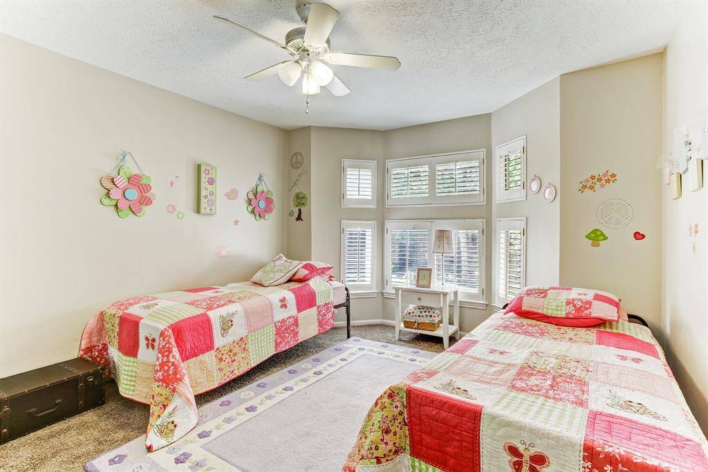 Third Bedroom with beautiful bay double pane window and plantation shutters.